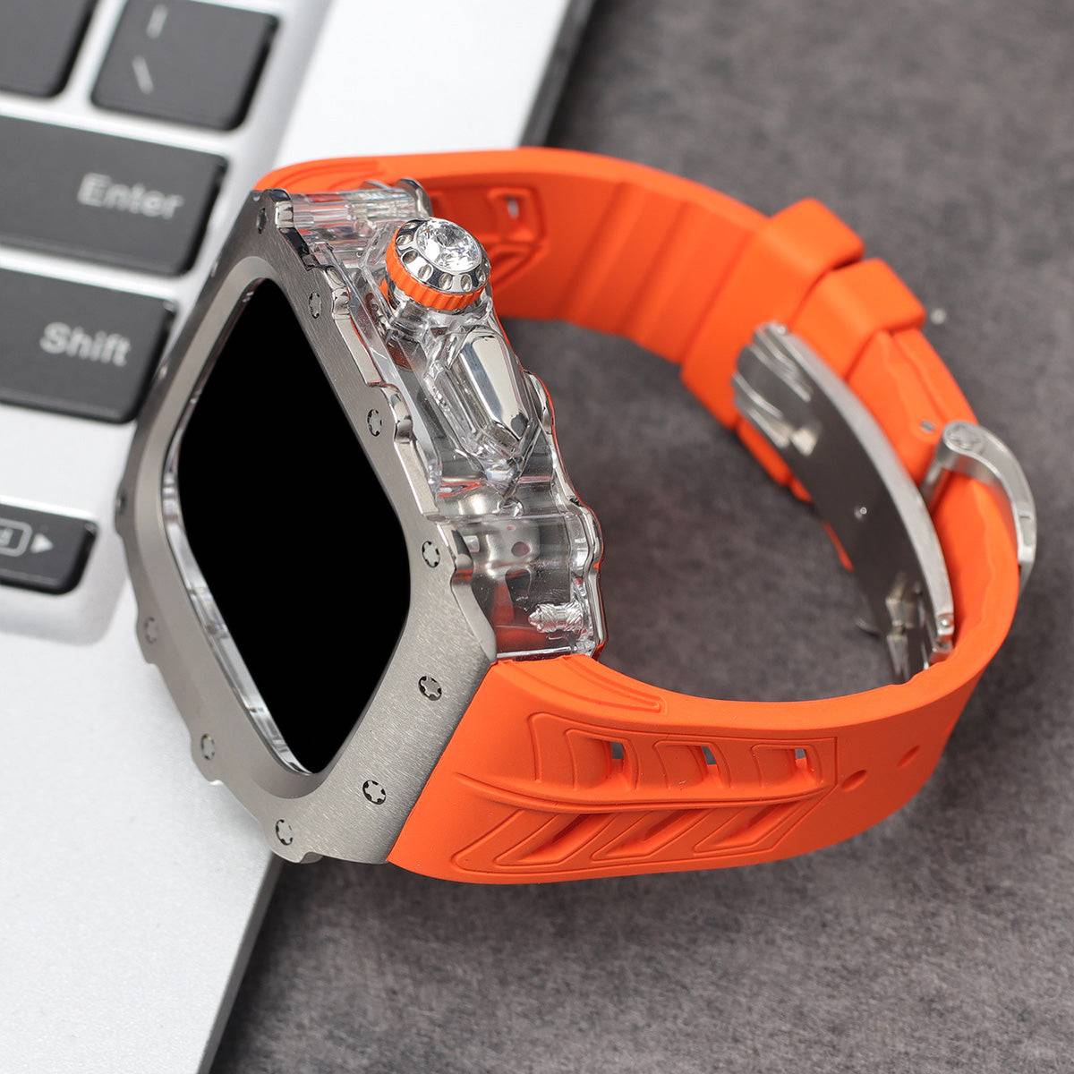 Apple Watch Series 10 Mod Kit with orange band and rugged titanium case.