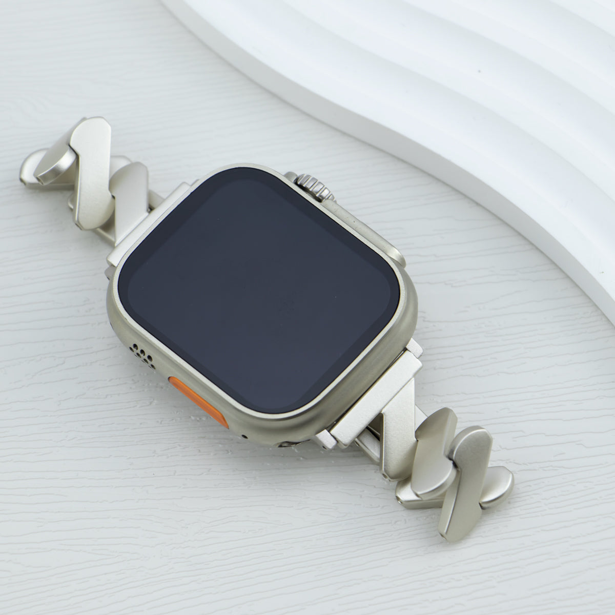 Zigzag design Starlight Apple Watch Band attached to watch, crafted in stainless steel for Series 10/9/8/7/6/5/4/SE/Ultra.