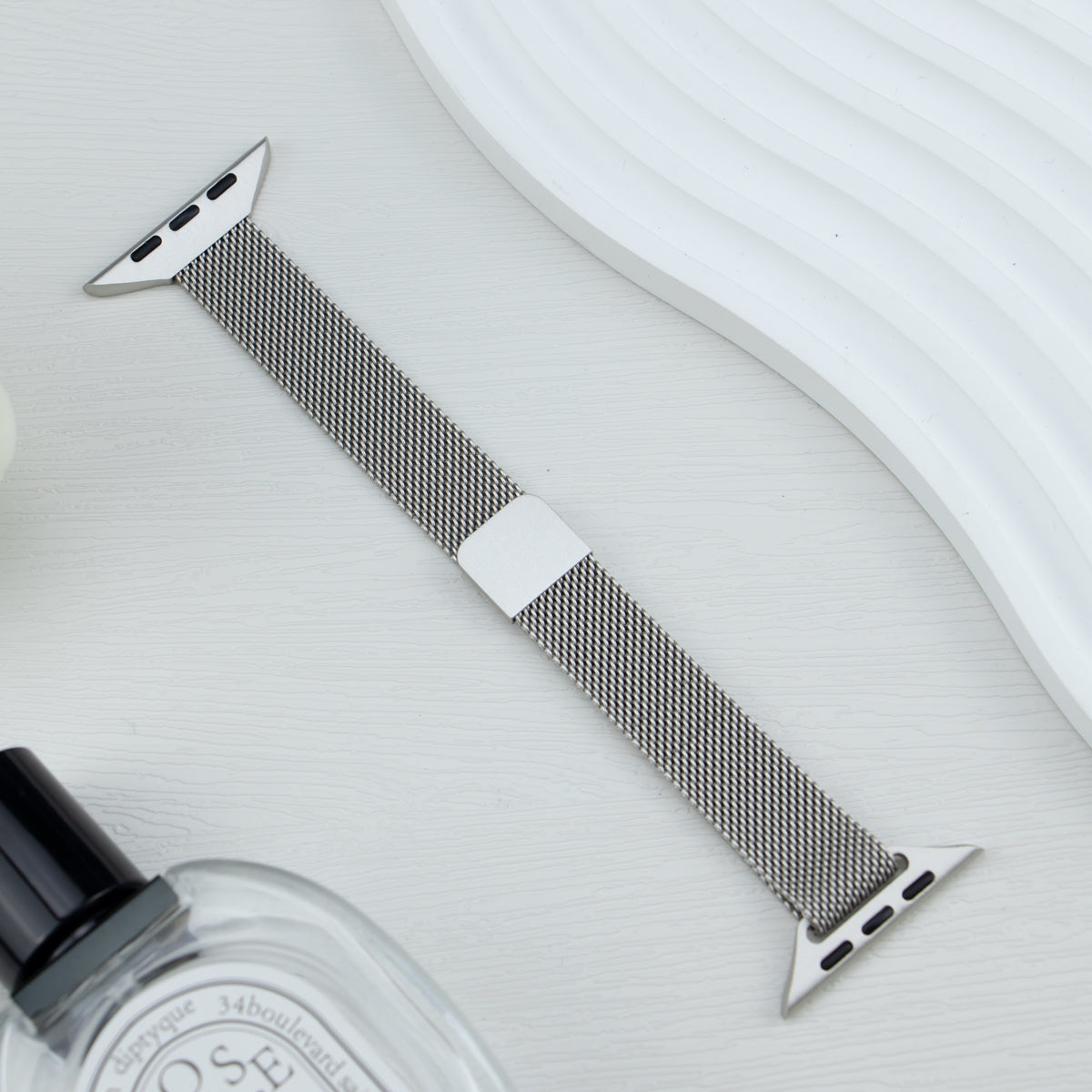 Starlight Apple Watch Band in stainless steel mesh design, compatible with Series 10/9/8/7/6/5/4/SE/Ultra, shown on a white surface.