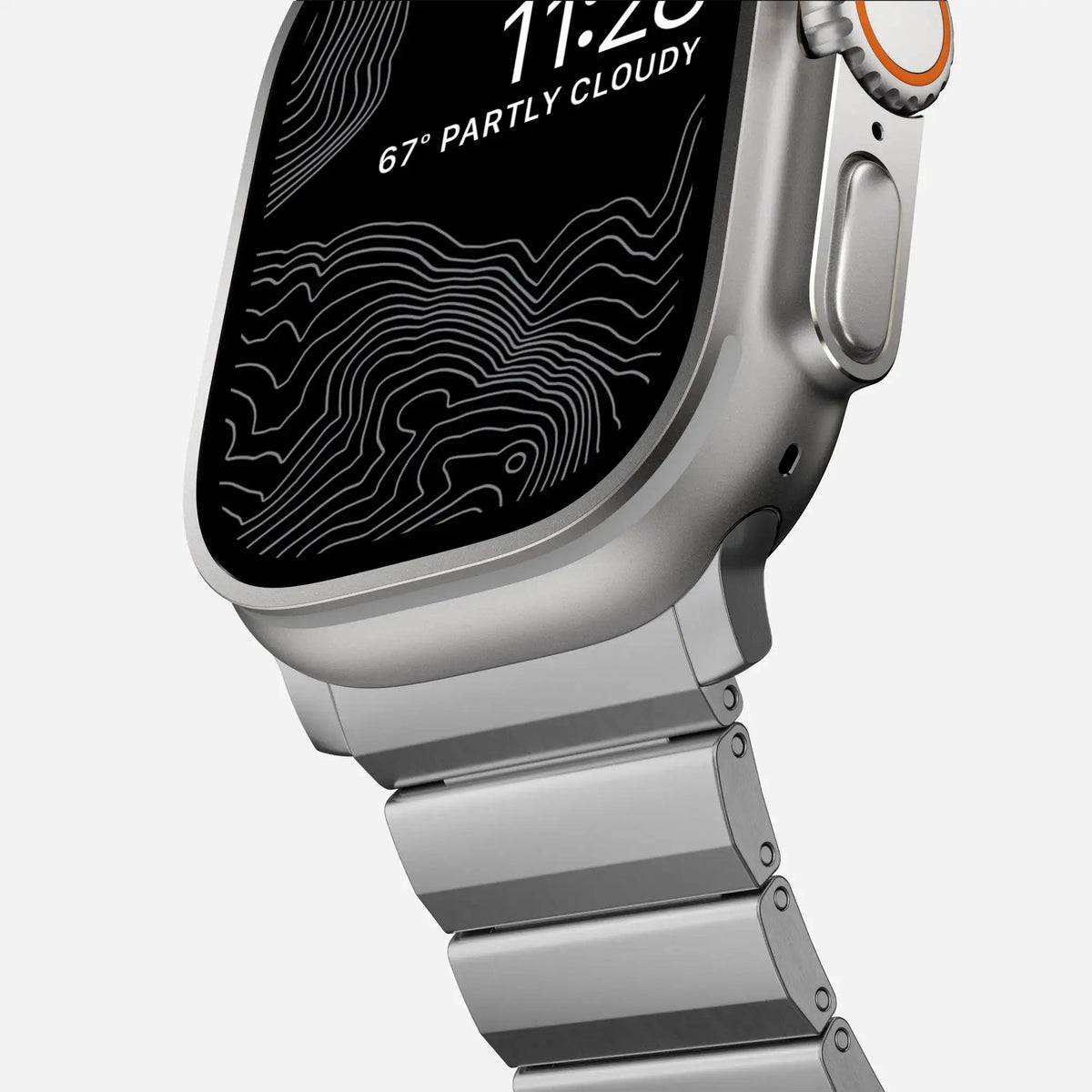 Close-up of a stainless steel Apple Watch band attached to an Apple Watch, highlighting its premium finish and durability.